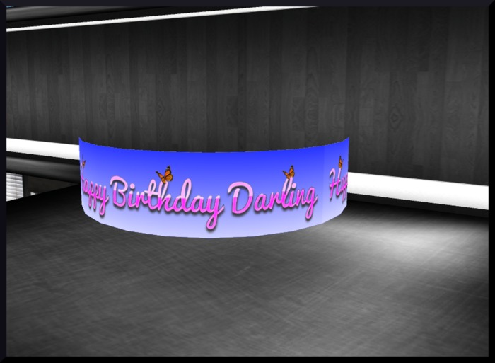 sign rotating pink "happy birthday"