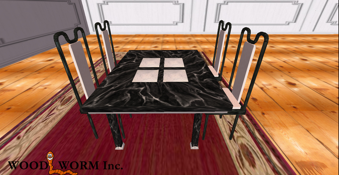 A black & white marble dining table with four chairs