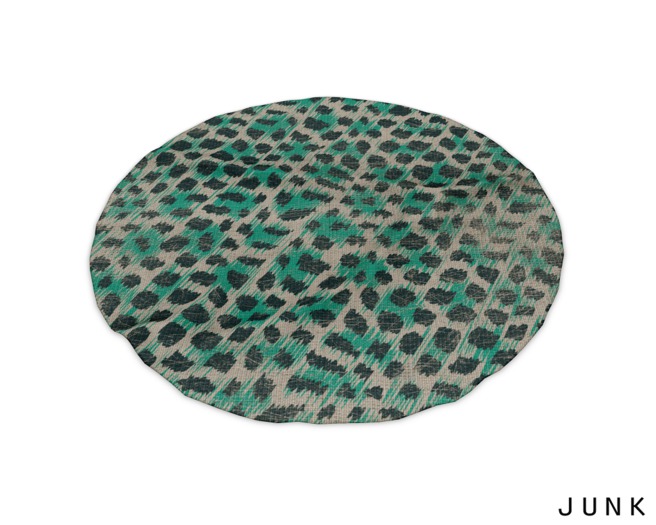 junk. round rug. green animal.