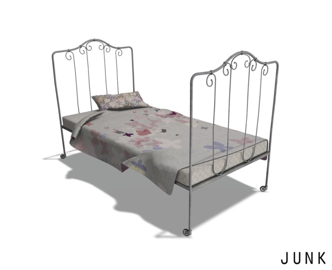junk. old metal bed. silver. butterflies.