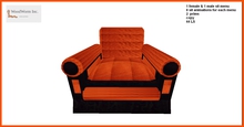 A cozy black armchair with orange cushion. Only 2 prims
