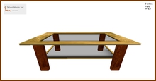An elegant coffee table with a dark glass plate