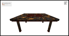 A two prim dining table with a lava rock frame and granite stones