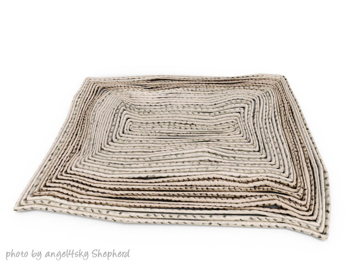 dust bunny . braided rug . boxed