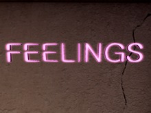 Pink 'FEELINGS' sign by They