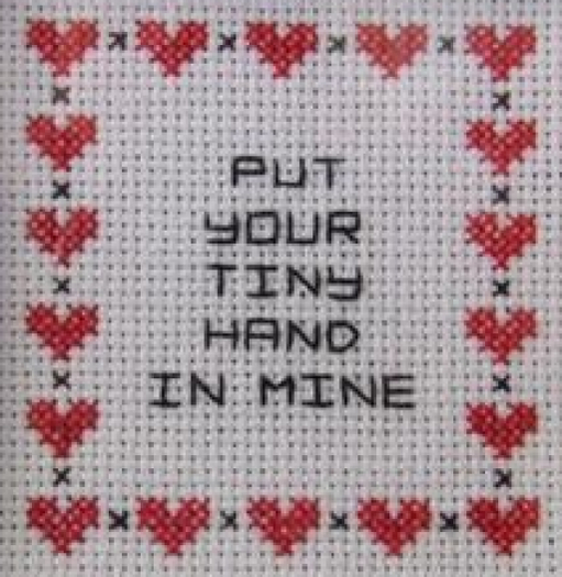 Tiny Hand in Mine Needlework Texture