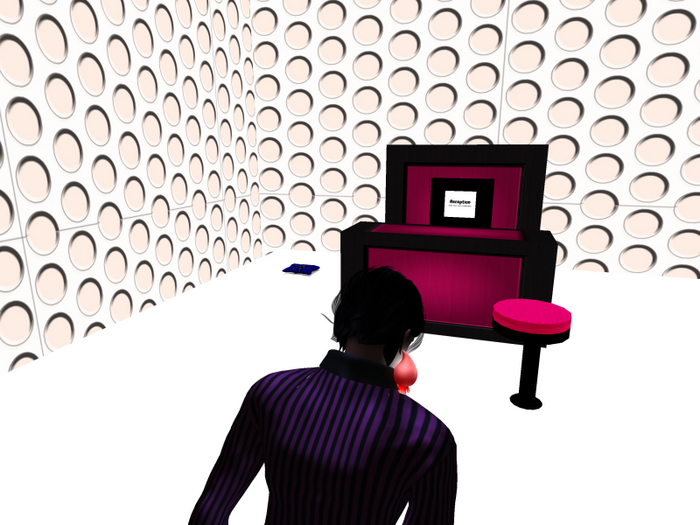 pink and black reception desk and stool