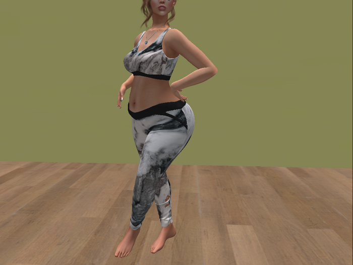 One in a melon black/white marble crop tank and leggings
