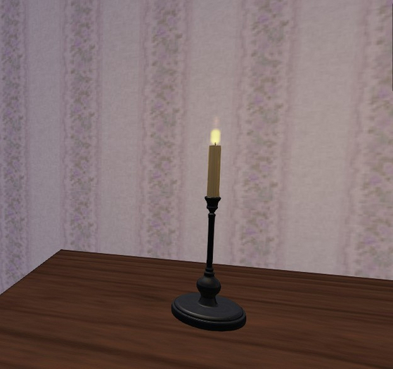 Candle with black metal candlestick