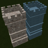 Large brick castle tower and another stone tower