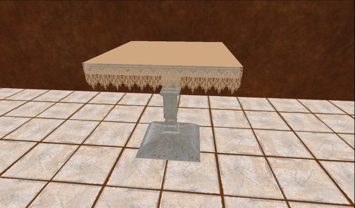 Square table with beige lace table cloth