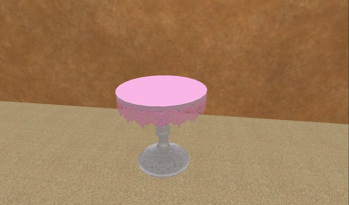 Round table with pink lace table cloth