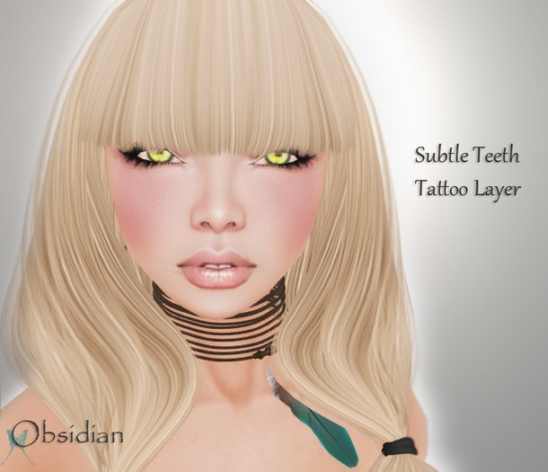 Obsidian "Subtle Buck" Teeth Tatttoo
