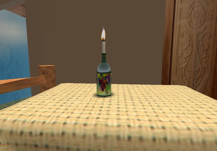 Green wine bottle with candle