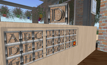 Monogram Kit from W'ily's Forge - polished metal on sandstone