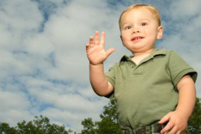 Boy Saying Hi Gesture