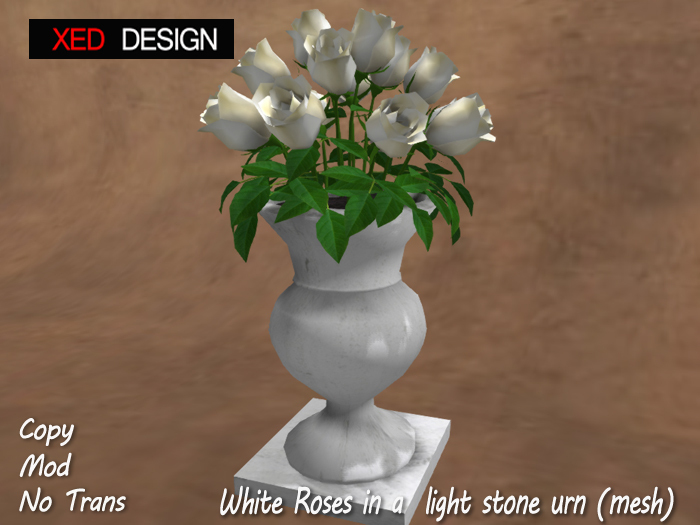 XD White Roses in a light stone urn (mesh) 